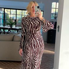 Emma Rose wearing a printed long-sleeve maxi dress.